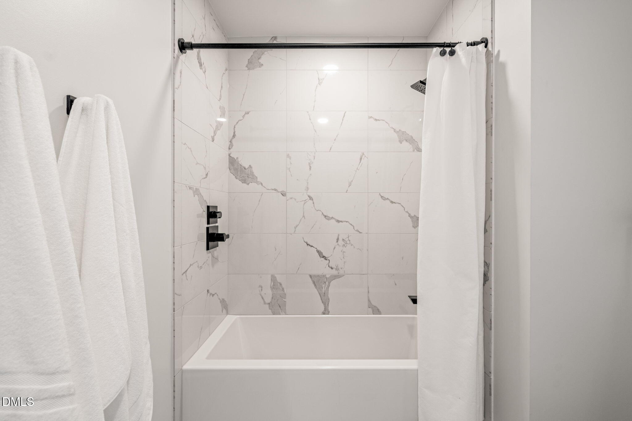 115 Morris Street, Unit 2501 Durham, NC 27701 - Photo 47 of 76 a bathroom with a shower and a bath tub