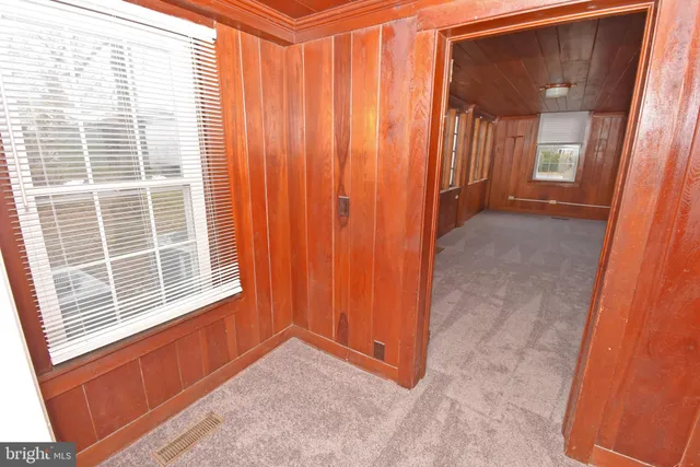 a bathroom with a toilet sink and a mirror