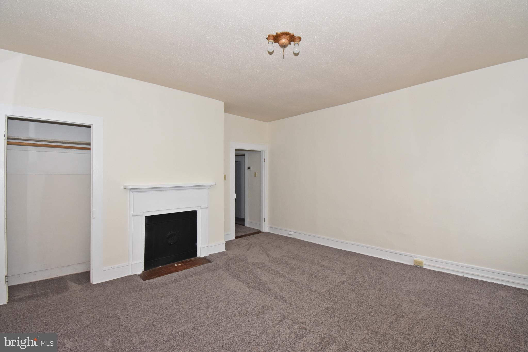 30472 Broad Street Princess Anne, MD 21853 - Photo 30 of 74 a view of empty room with a fireplace