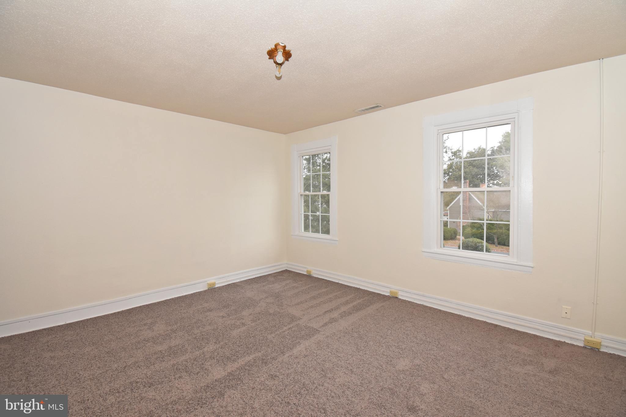 30472 Broad Street Princess Anne, MD 21853 - Photo 31 of 74 an empty room with windows