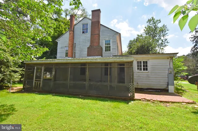 a view of empty room with fireplace