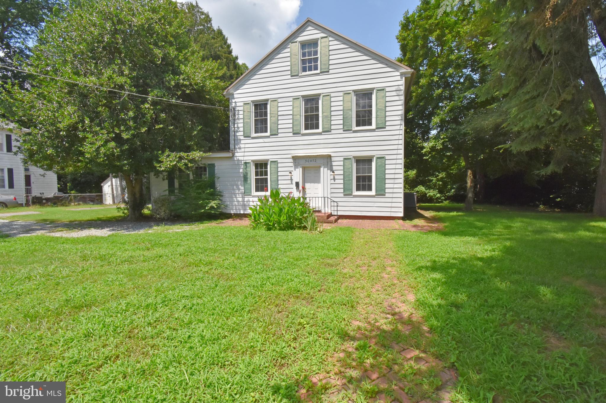 30472 Broad Street Princess Anne, MD 21853 - Photo 43 of 74 a front view of a house with garden