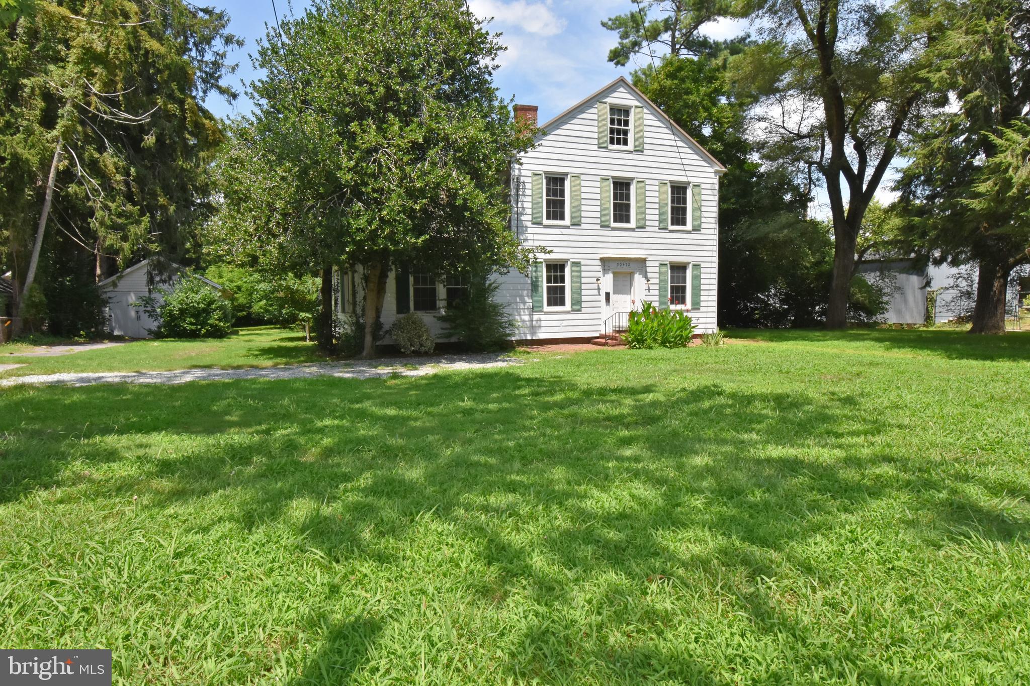 30472 Broad Street Princess Anne, MD 21853 - Photo 44 of 74 a front view of a house with a garden