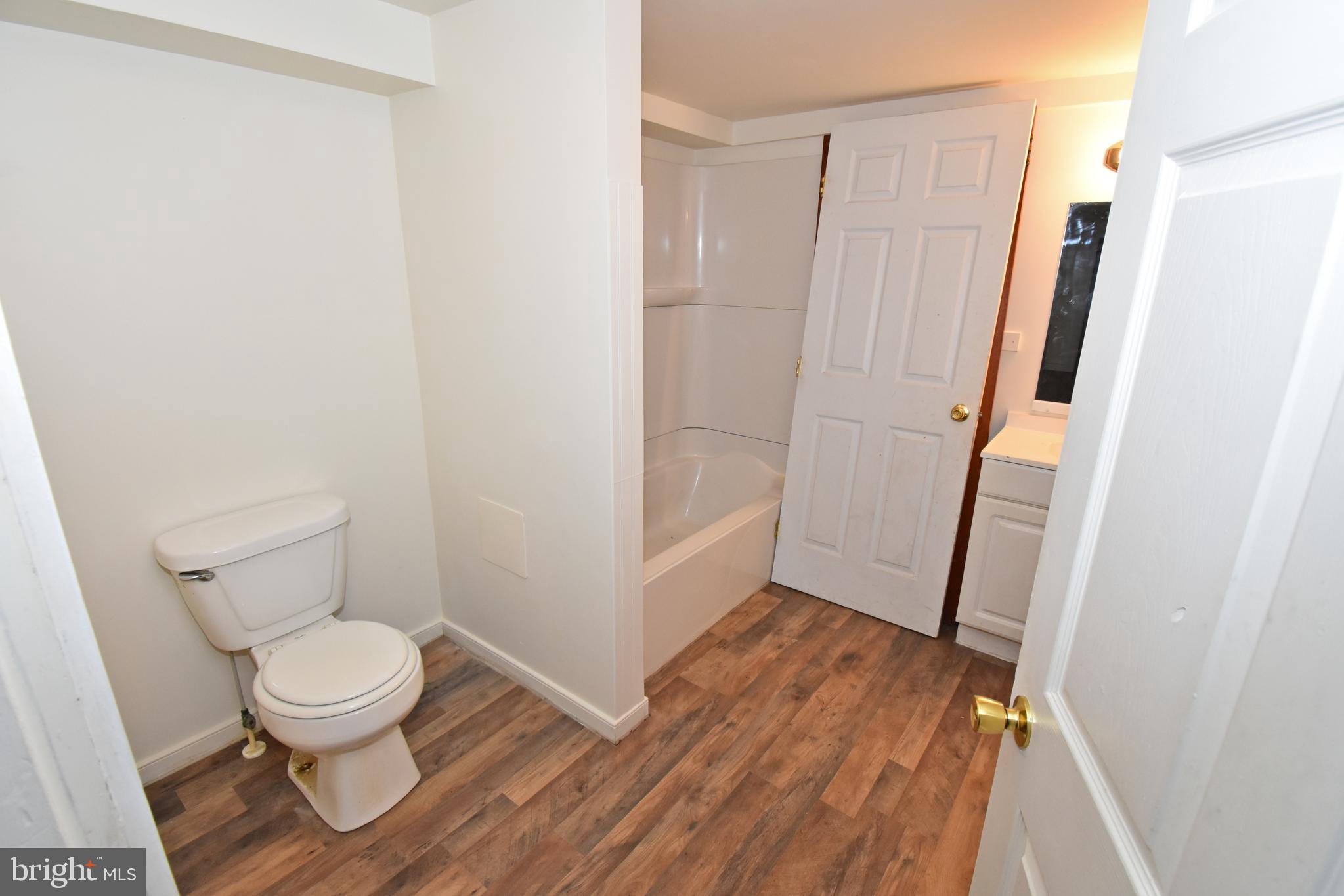 30472 Broad Street Princess Anne, MD 21853 - Photo 45 of 74 a bathroom with a toilet and a shower