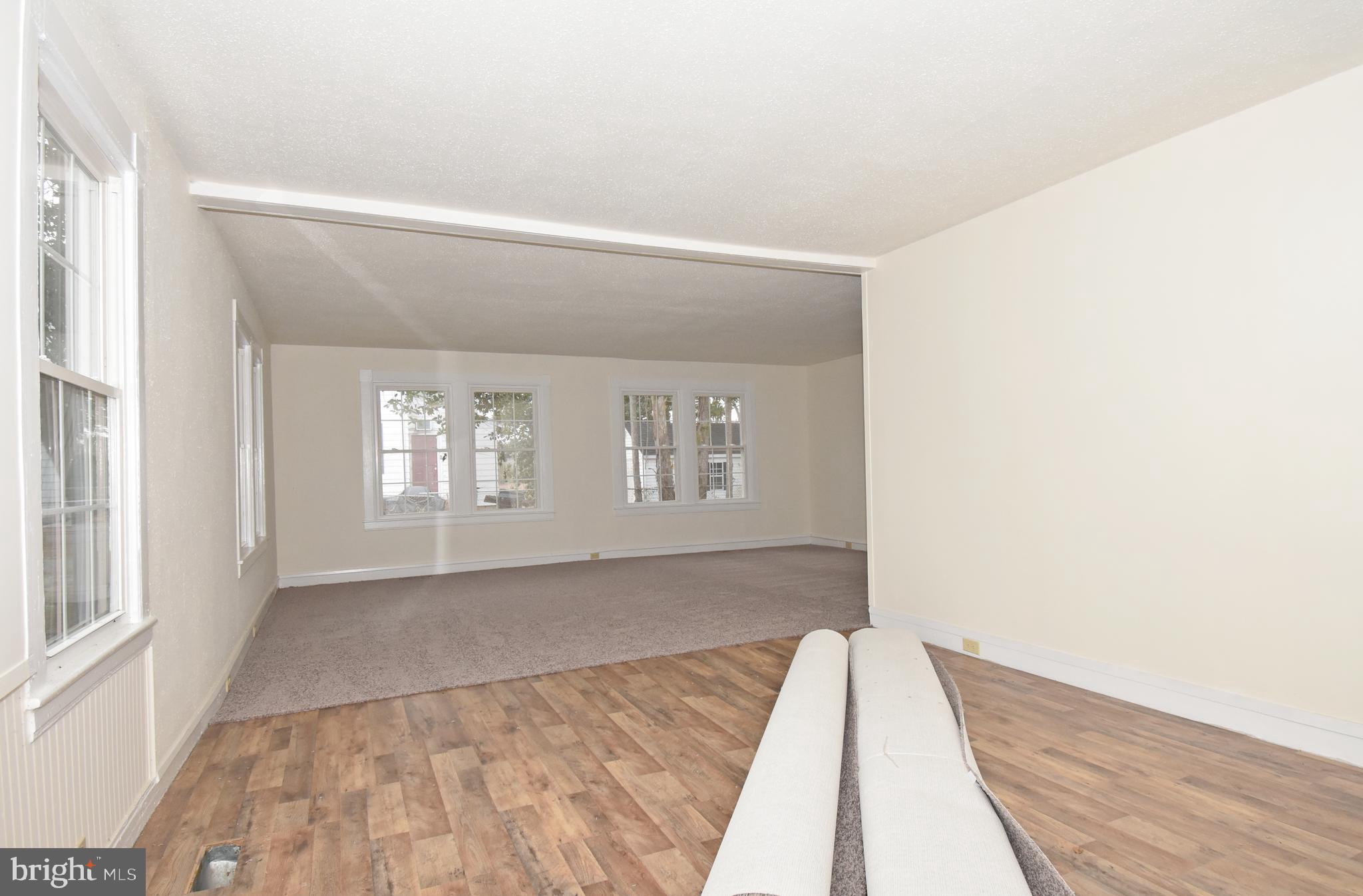 30472 Broad Street Princess Anne, MD 21853 - Photo 49 of 74 a view of a big room with wooden floor and windows
