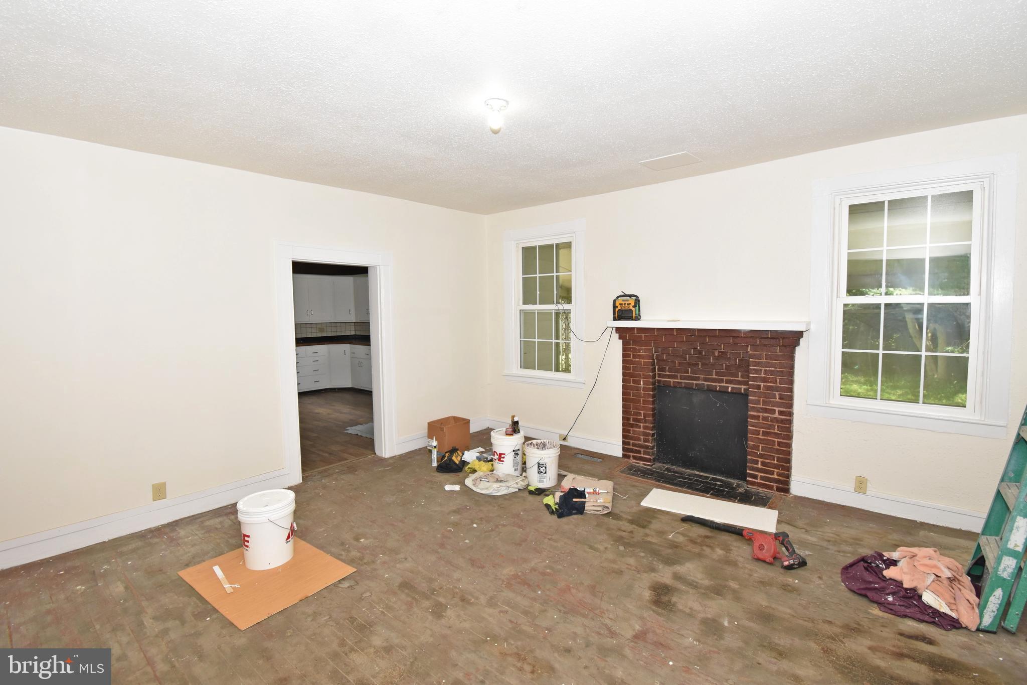 30472 Broad Street Princess Anne, MD 21853 - Photo 60 of 74 a living room with furniture and a fireplace