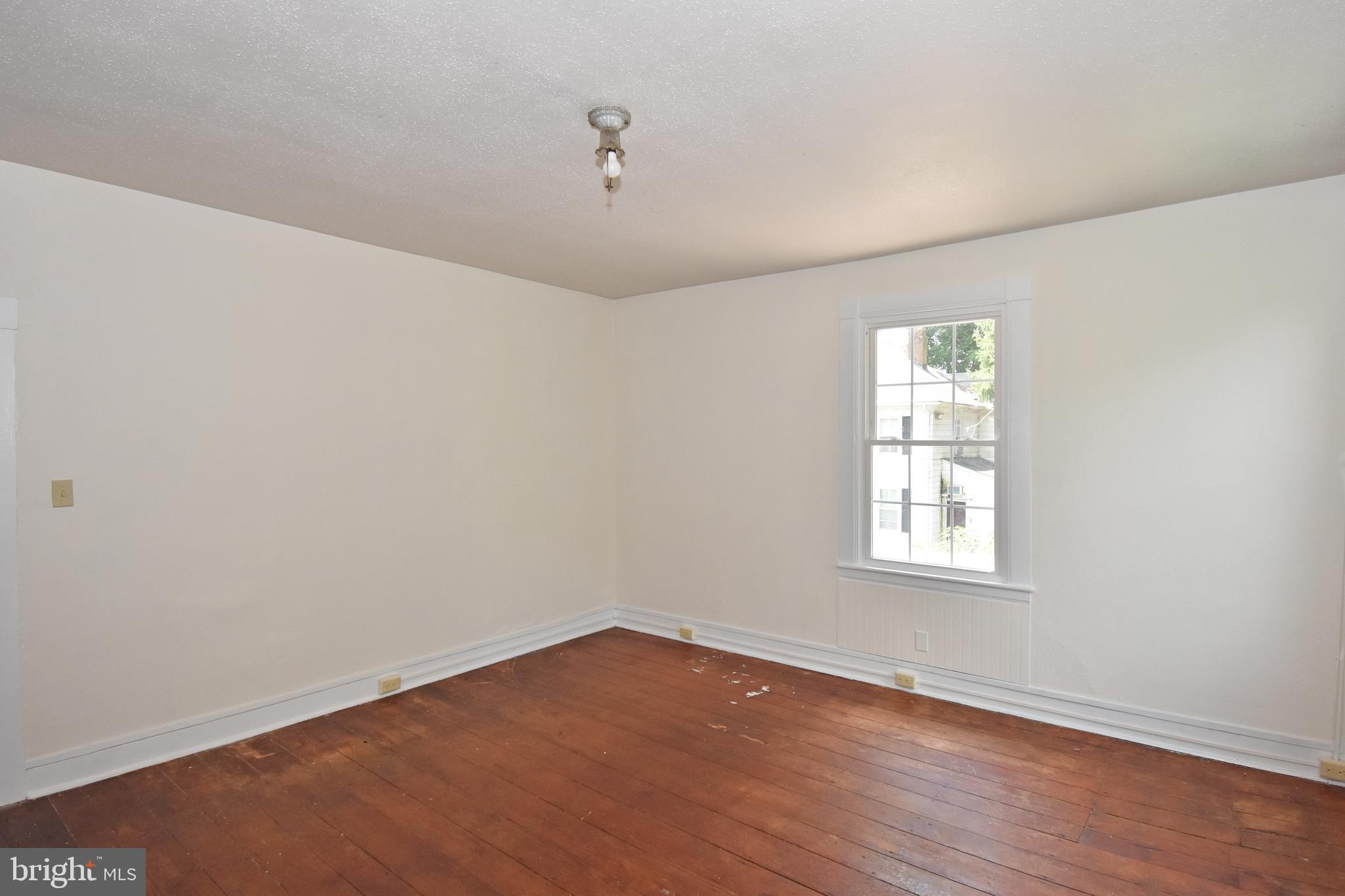 30472 Broad Street Princess Anne, MD 21853 - Photo 70 of 74 an empty room with wooden floor and windows
