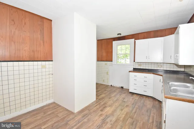 a bathroom with a toilet a sink and bathtub