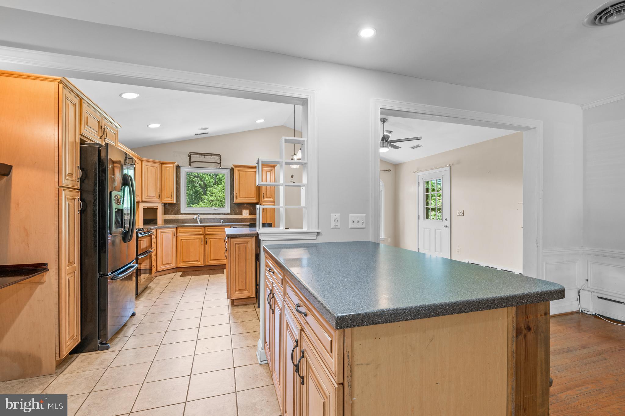 312 Whitaker Mill Road Fallston, MD 21047 - Photo 11 of 57 a kitchen with stainless steel appliances granite countertop a sink a stove and a refrigerator