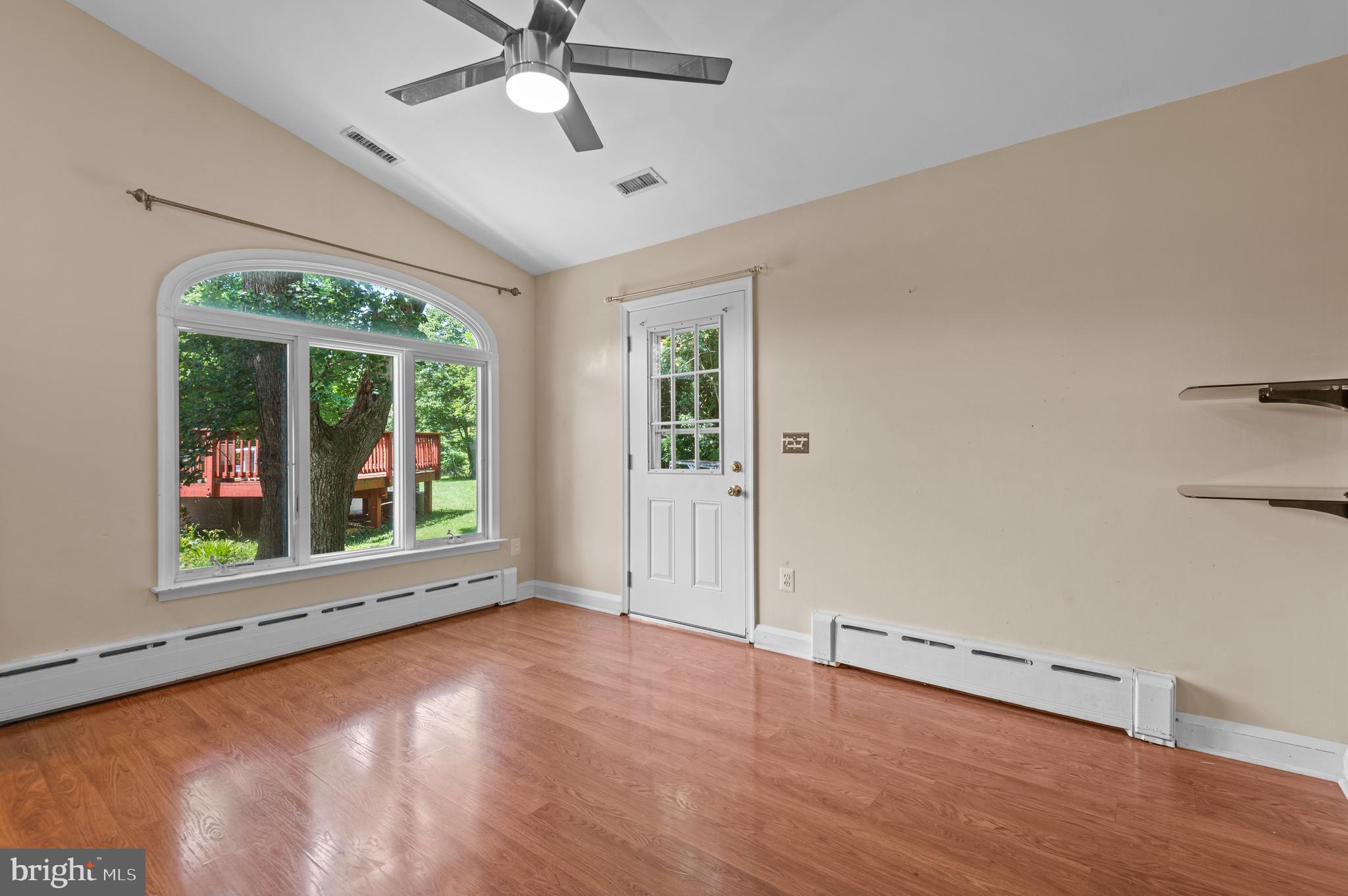 312 Whitaker Mill Road Fallston, MD 21047 - Photo 17 of 57 an empty room with wooden floor and windows