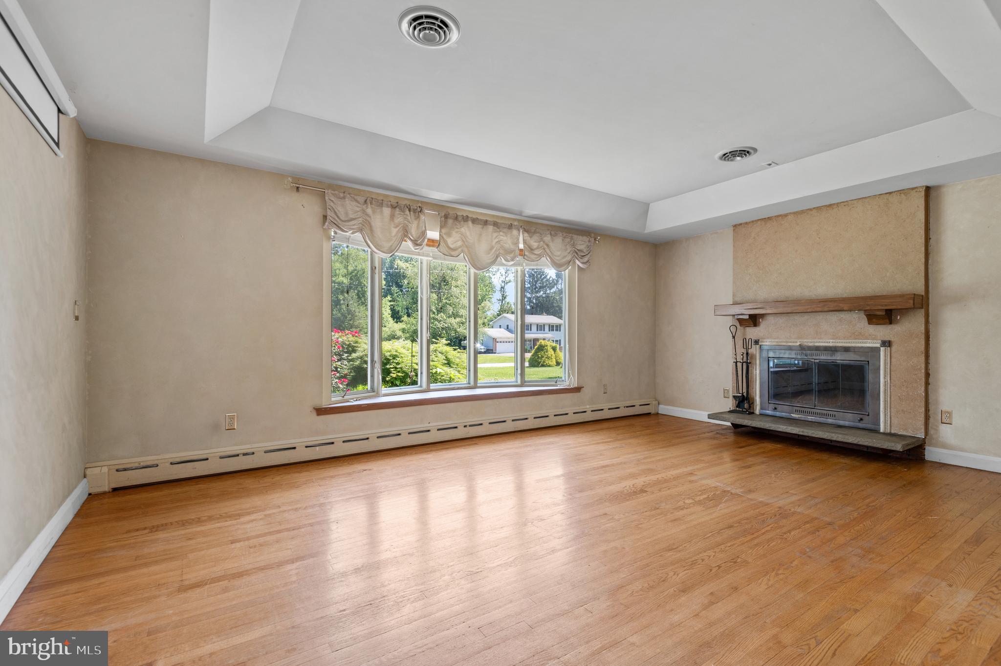 312 Whitaker Mill Road Fallston, MD 21047 - Photo 20 of 57 a view of empty room with wooden floor and fireplace