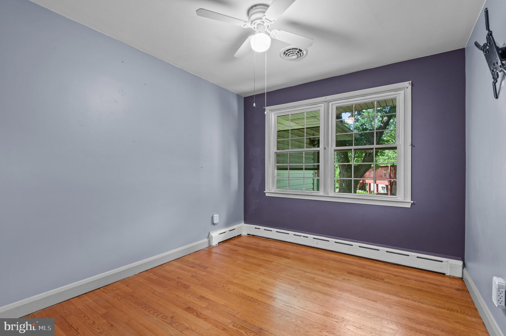 312 Whitaker Mill Road Fallston, MD 21047 - Photo 34 of 57 an empty room with a window and ceiling fan