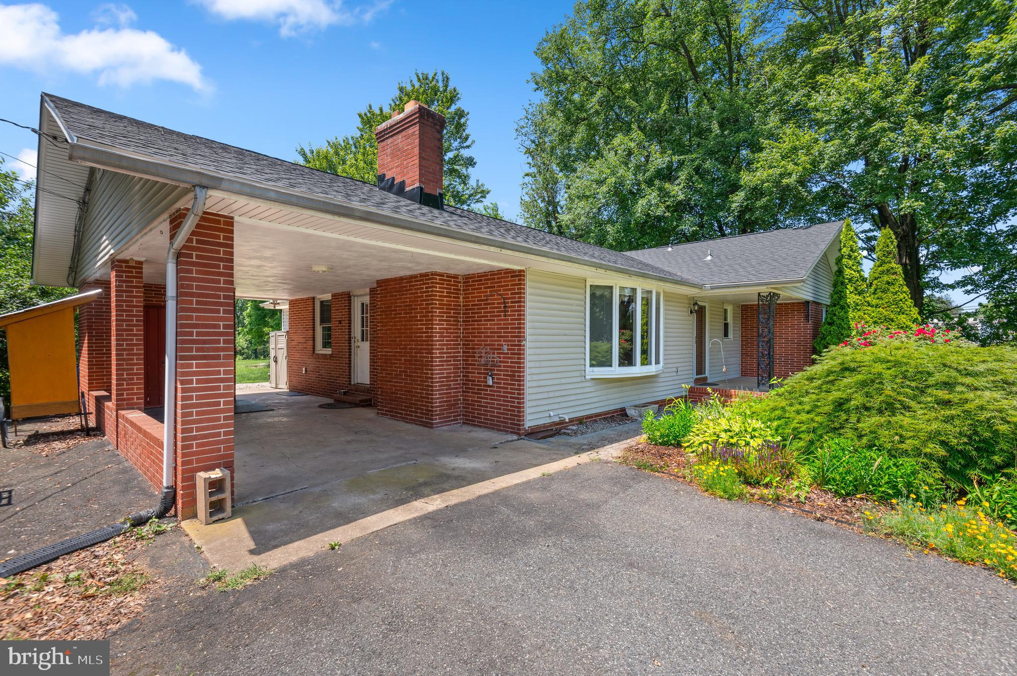 312 Whitaker Mill Road Fallston, MD 21047 - Photo 4 of 57 a front view of a house with garden