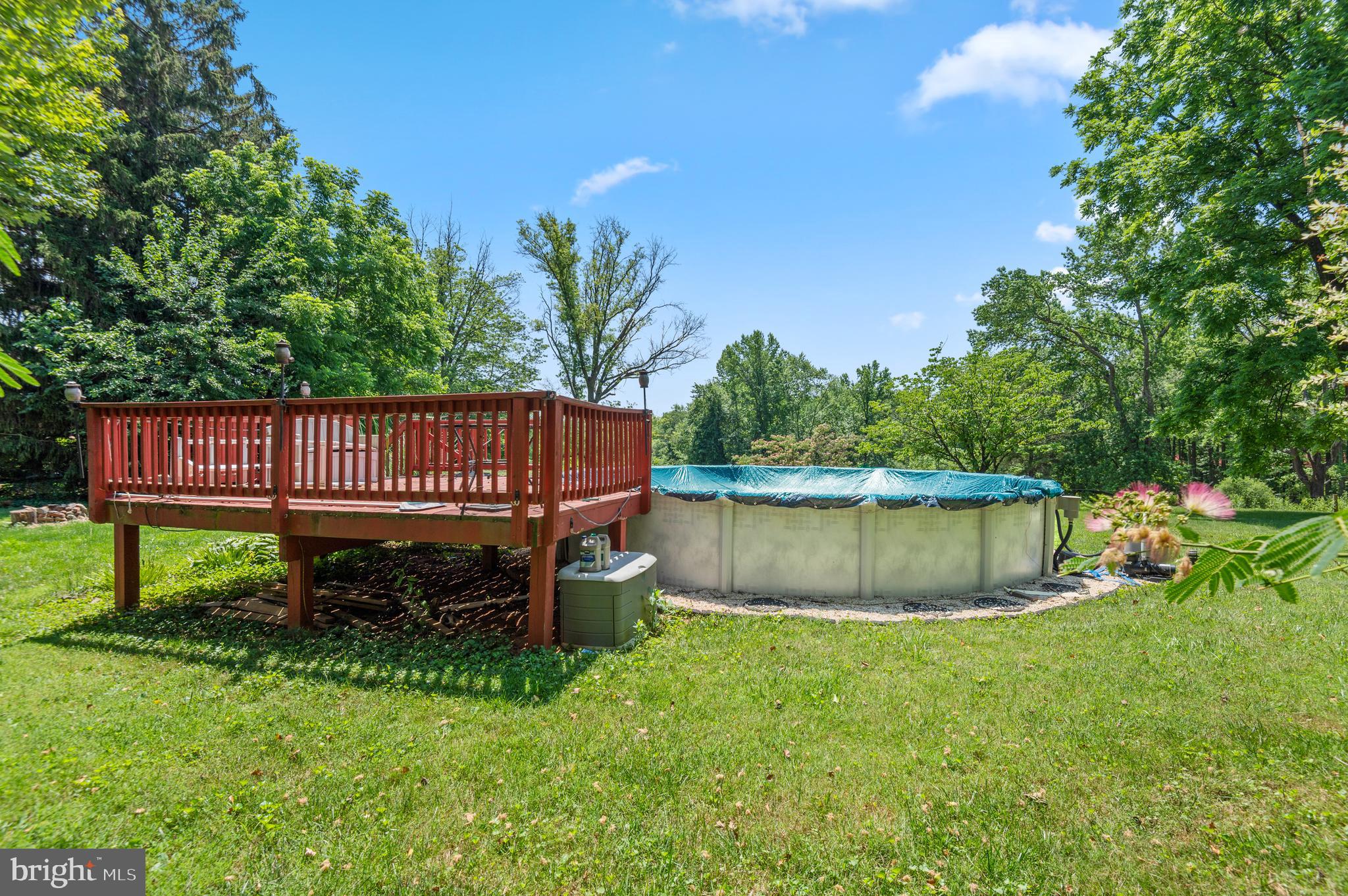 312 Whitaker Mill Road Fallston, MD 21047 - Photo 50 of 57 a view of a garden with a bench