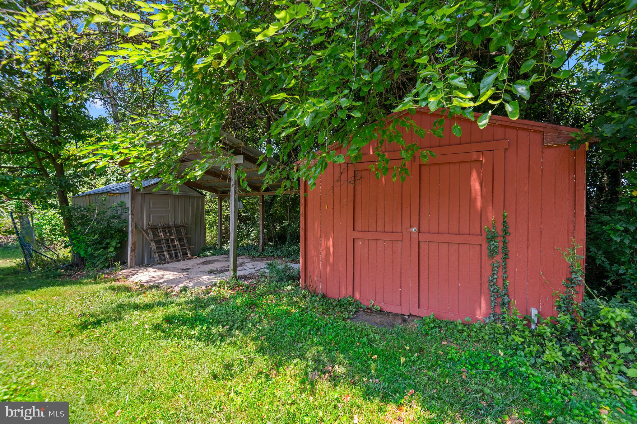 312 Whitaker Mill Road Fallston, MD 21047 - Photo 52 of 57 a view of a backyard with large trees and wooden fence
