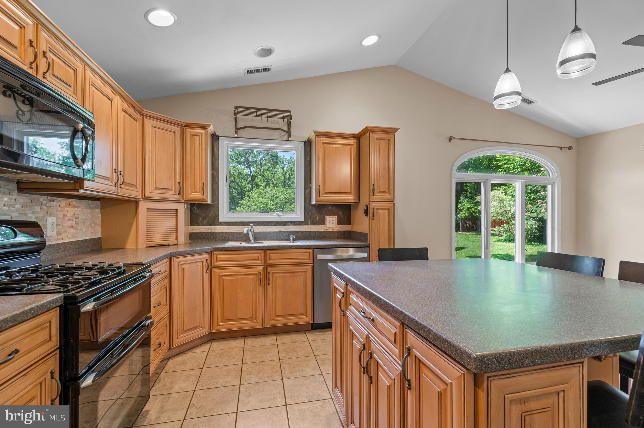 312 Whitaker Mill Road Fallston, MD 21047 - Photo 9 of 57 a kitchen with stainless steel appliances granite countertop a sink a stove cabinets counter space and a window