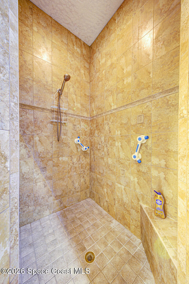 1090 Castile Road Southeast Palm Bay, FL 32909 - Photo 17 of 23 a bathroom with a shower
