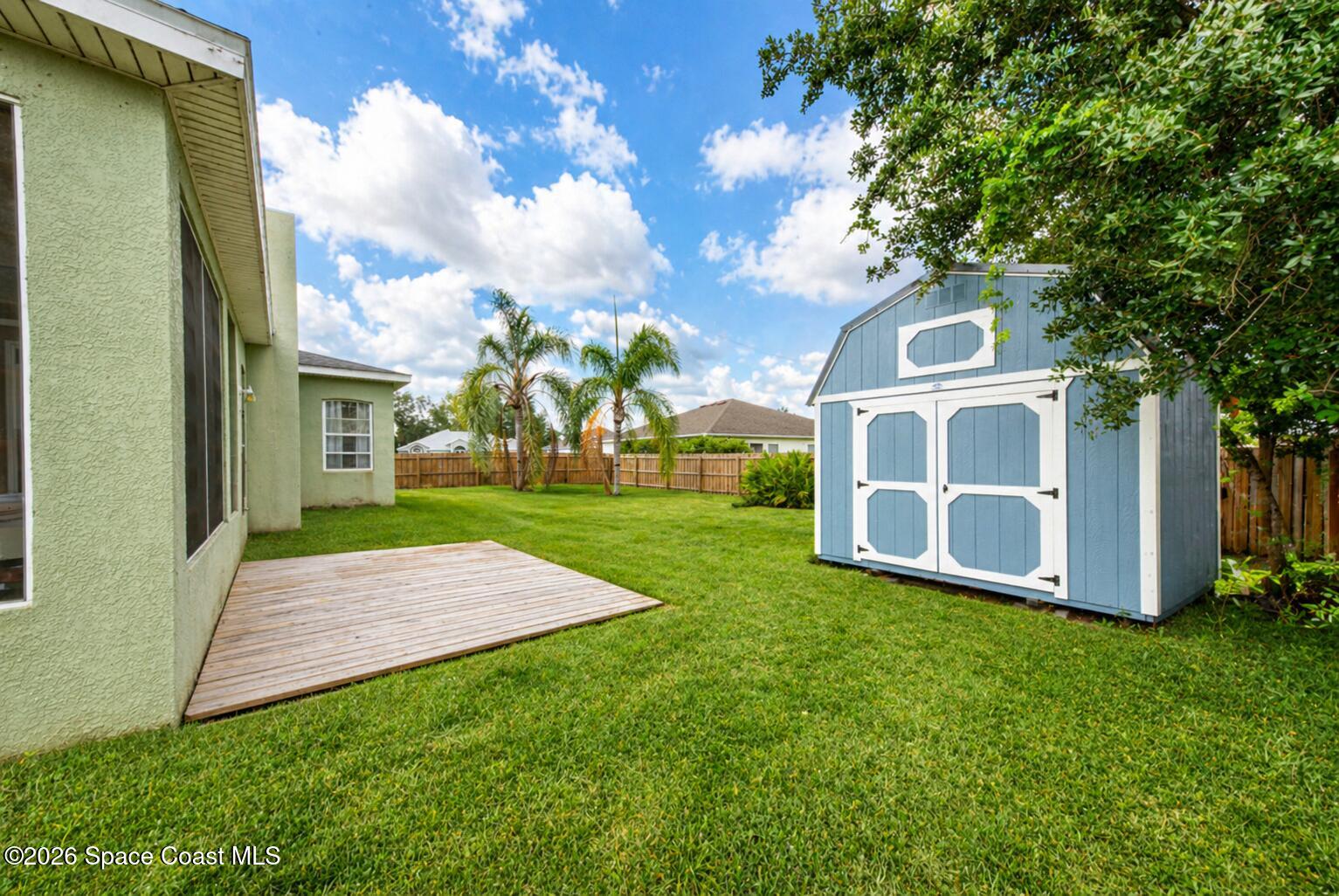1090 Castile Road Southeast Palm Bay, FL 32909 - Photo 23 of 23 a view of yard with tree s