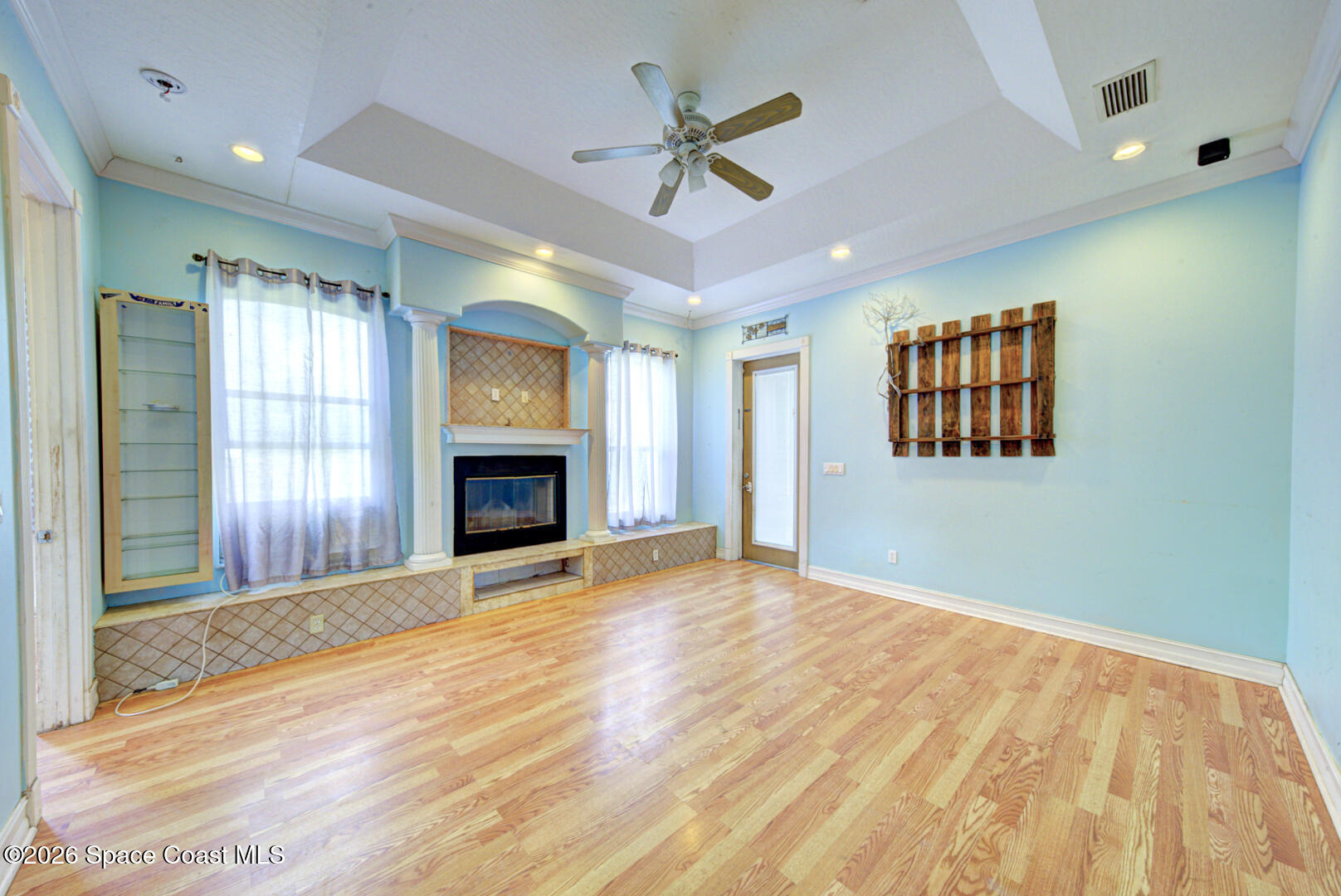 1090 Castile Road Southeast Palm Bay, FL 32909 - Photo 6 of 23 a view of an empty room with window and a kitchen