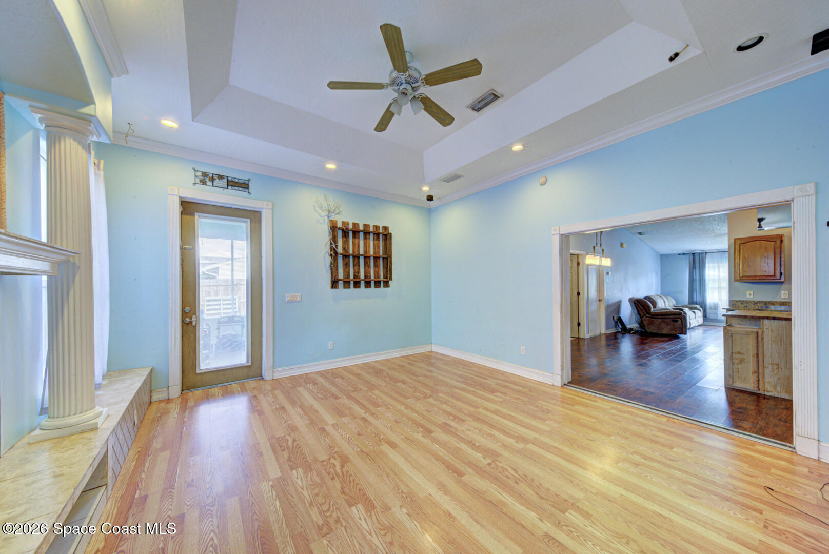 1090 Castile Road Southeast Palm Bay, FL 32909 - Photo 7 of 23 a bedroom with bed and a chandelier