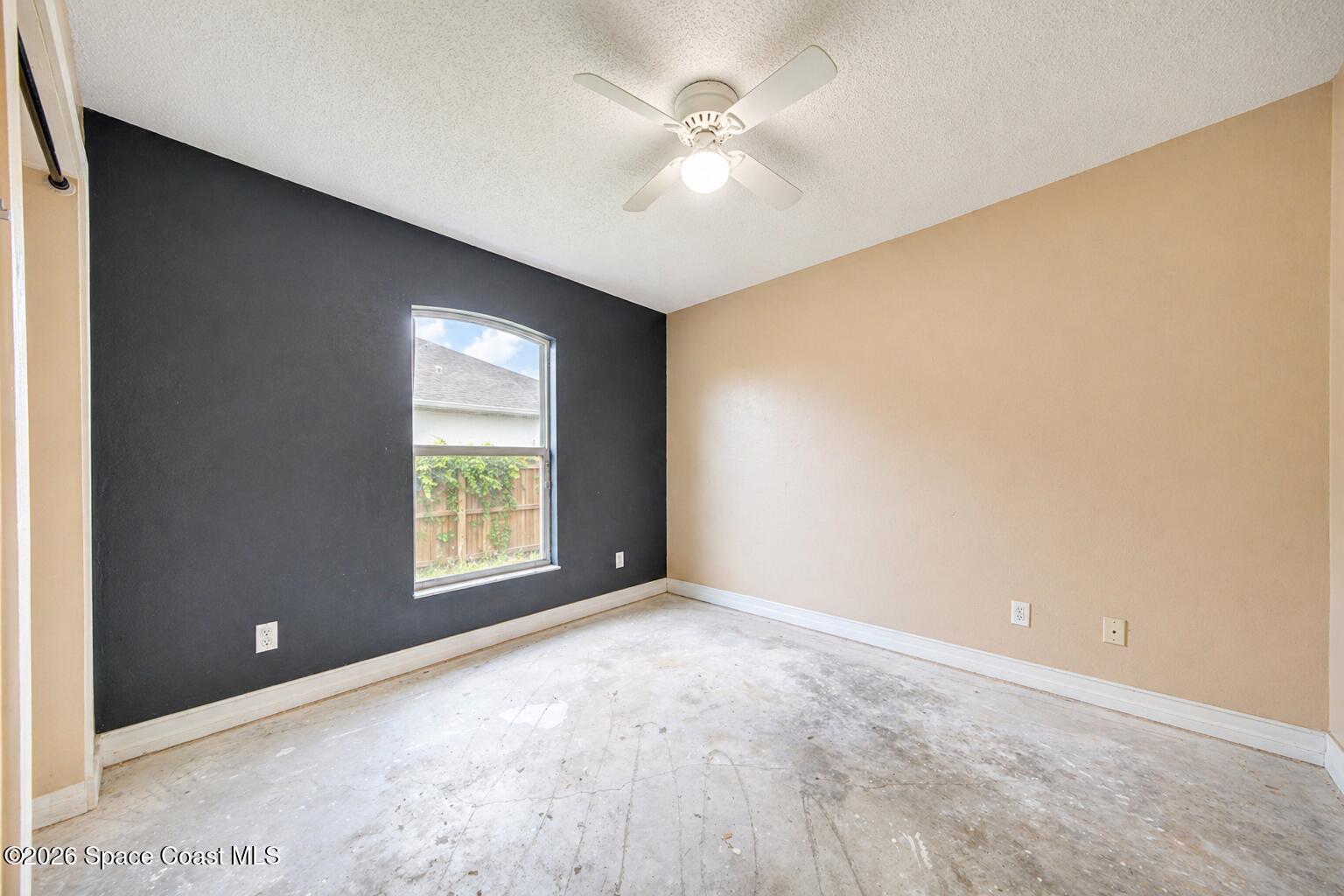 1090 Castile Road Southeast Palm Bay, FL 32909 - Photo 10 of 23 a view of an empty room with a window