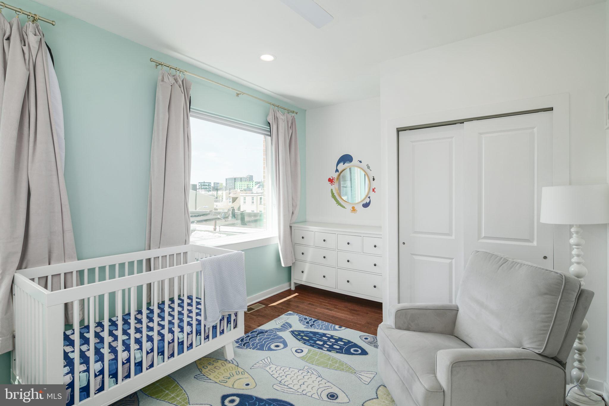 159 East Allen Street, Unit 1 Philadelphia, PA 19125 - Photo 33 of 45 a bedroom with furniture and a window