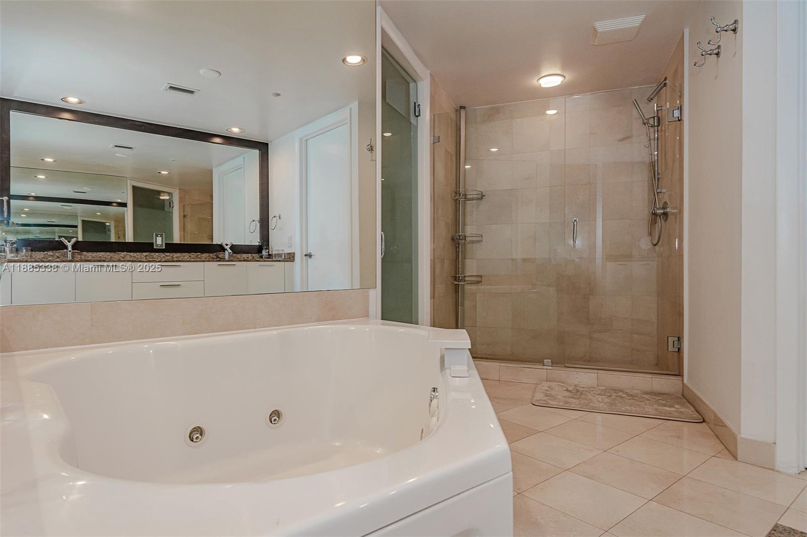 18911 Collins Avenue, Unit 3402 Sunny Isles Beach, FL 33160 - Photo 18 of 27 a bathroom with a bathtub and a shower
