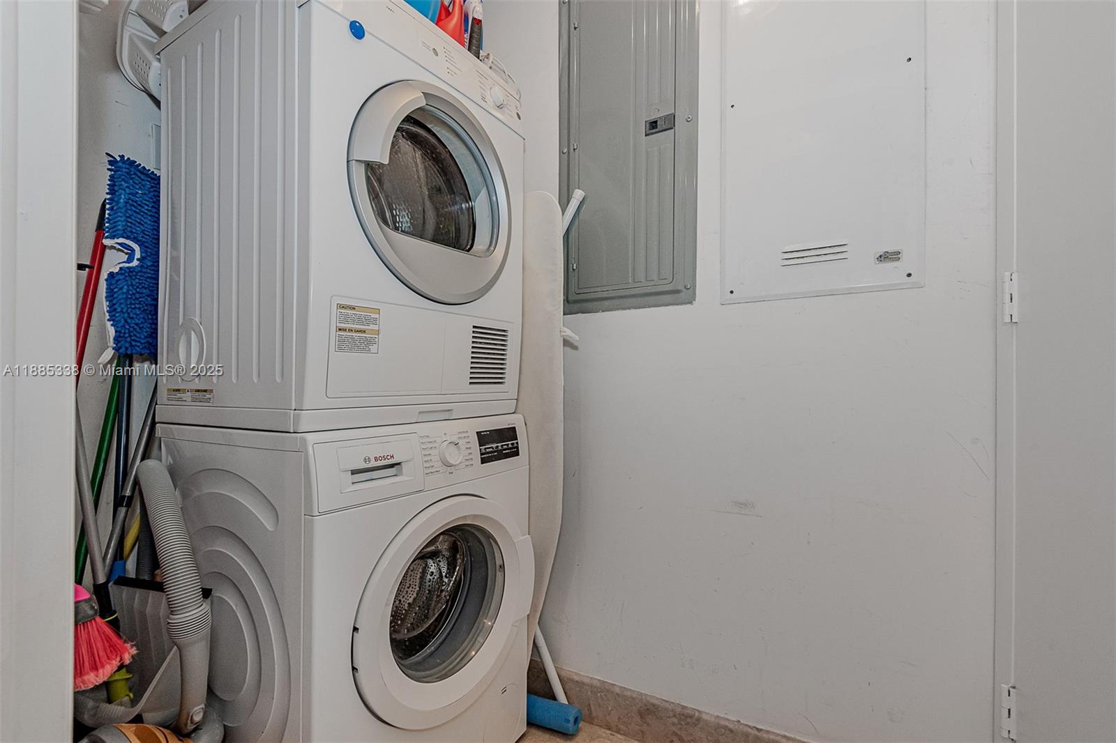 18911 Collins Avenue, Unit 3402 Sunny Isles Beach, FL 33160 - Photo 24 of 27 a utility room with dryer and washer