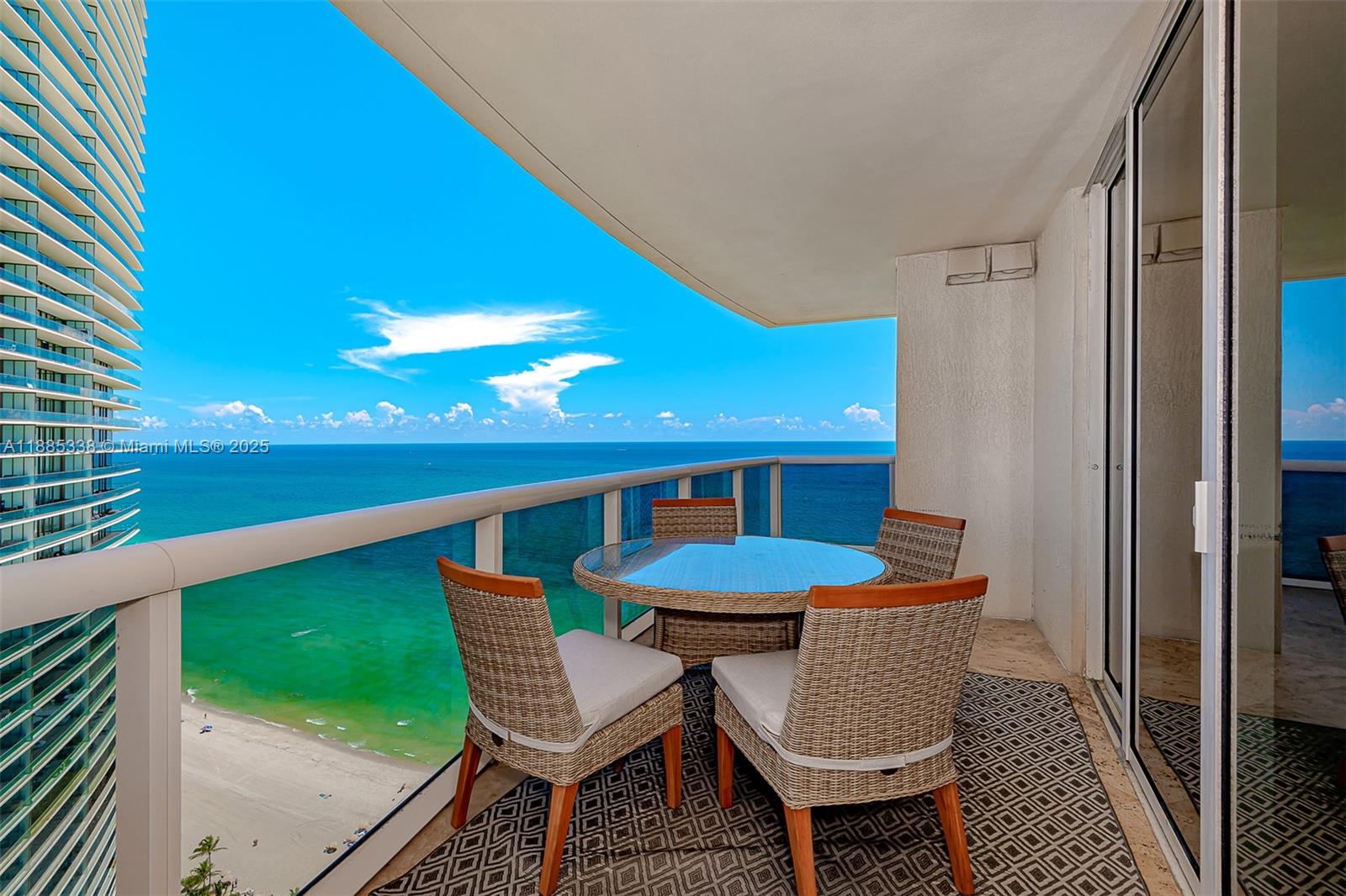 18911 Collins Avenue, Unit 3402 Sunny Isles Beach, FL 33160 - Photo 25 of 27 a view of a balcony with chairs