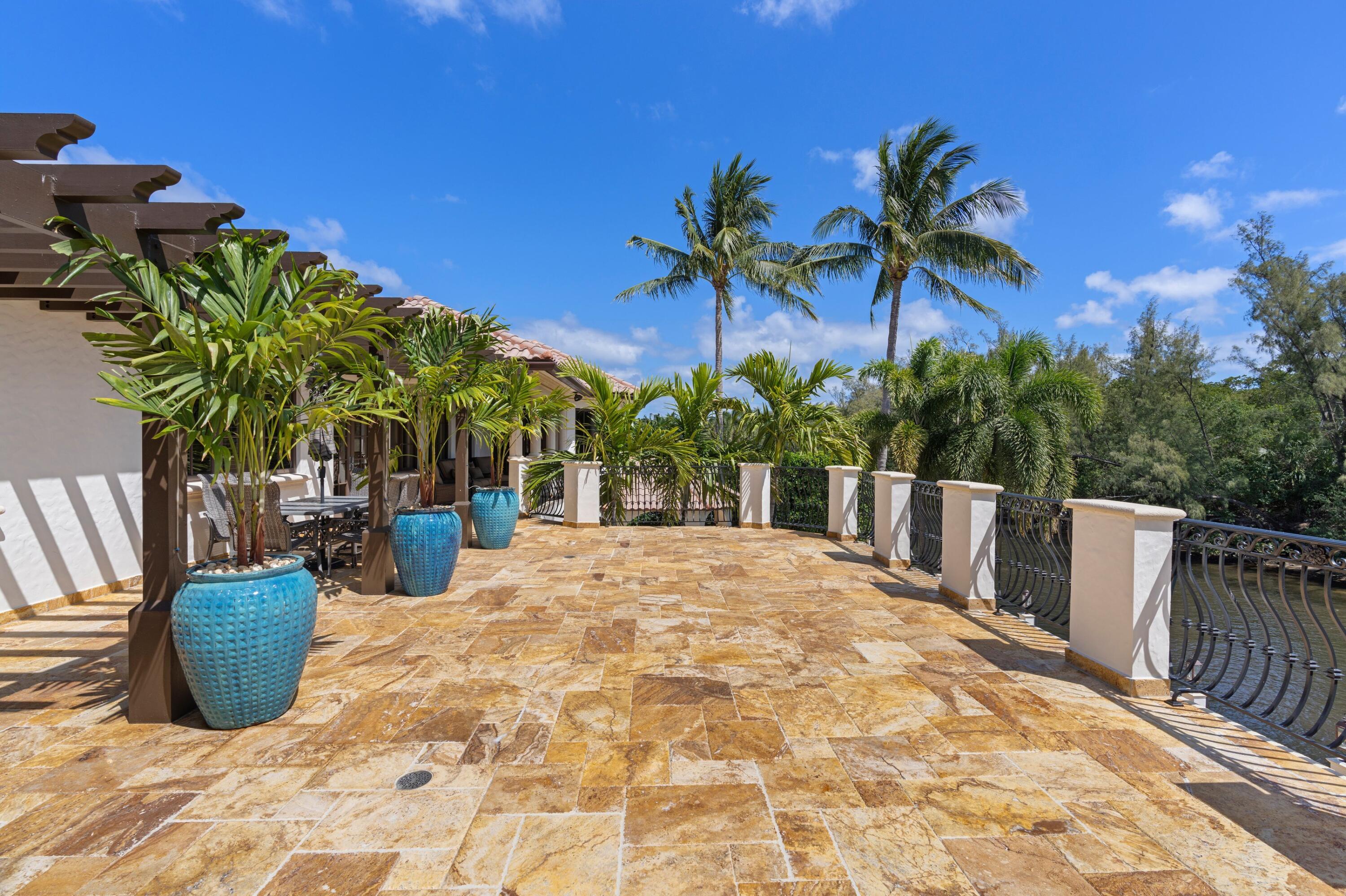 166 Alexander Palm Road Boca Raton, FL 33432 - Photo 104 of 122 a view of a backyard of the house