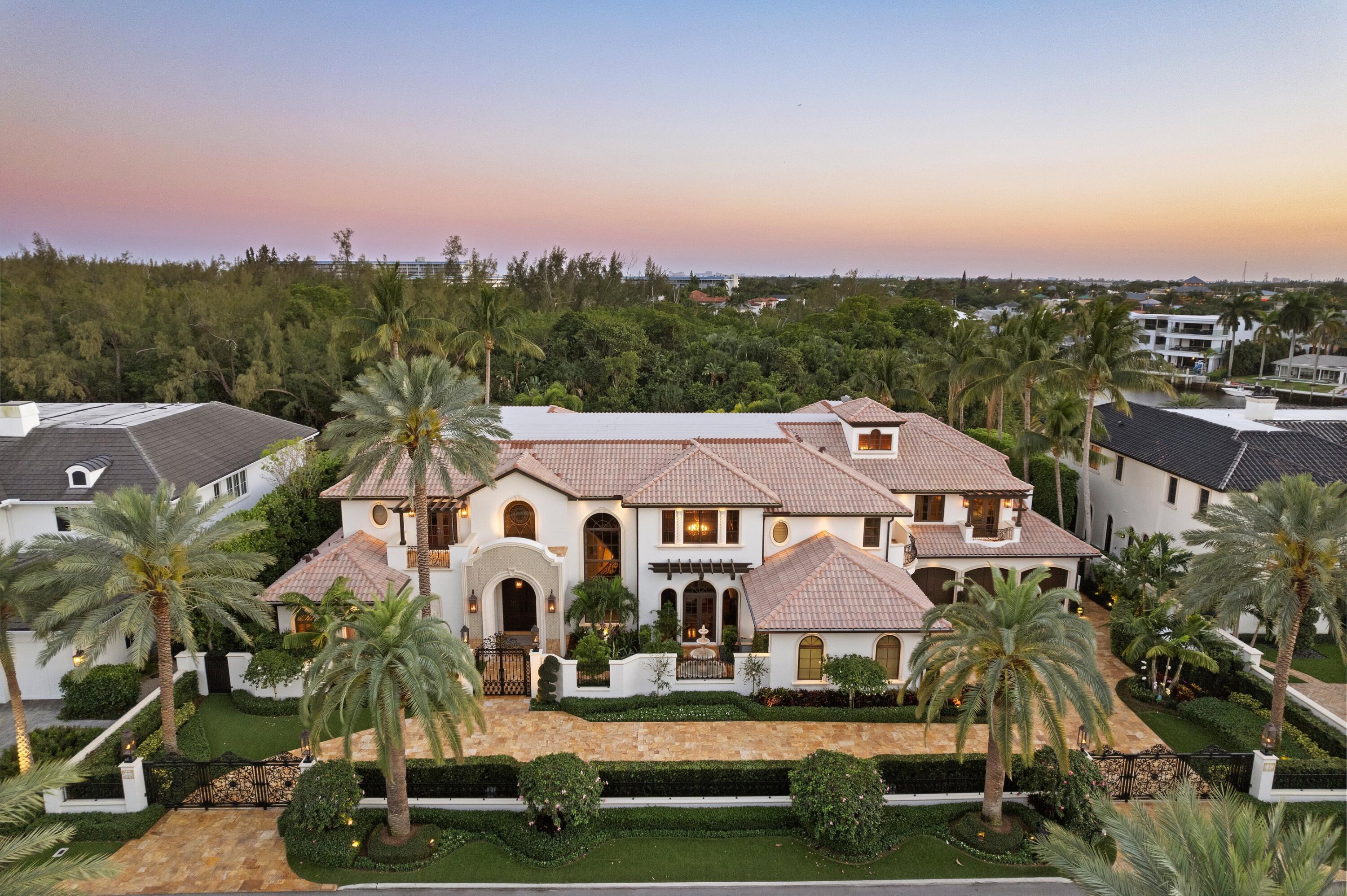 166 Alexander Palm Road Boca Raton, FL 33432 - Photo 117 of 122 a front view of house with yard and trees in the background