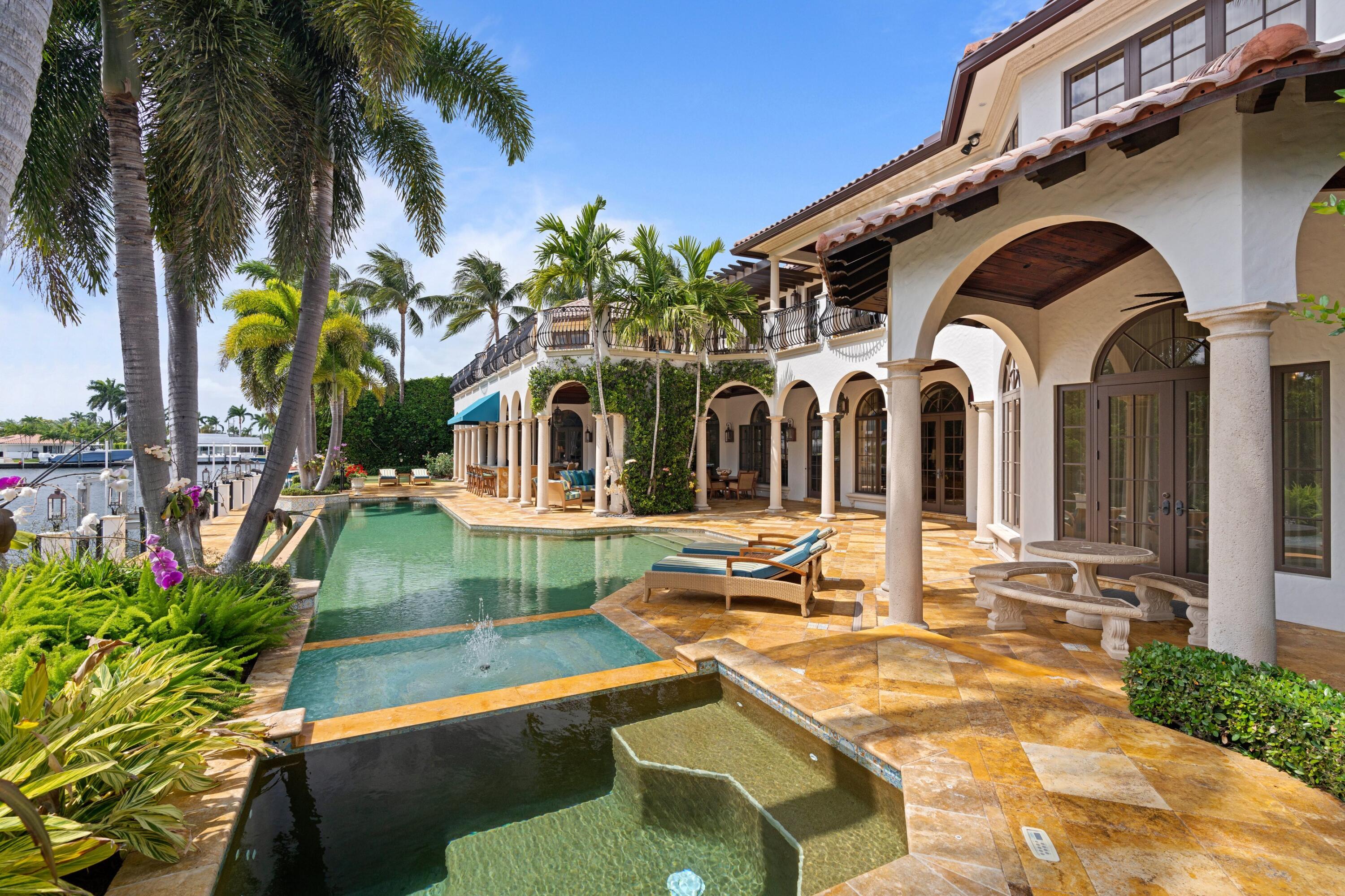 166 Alexander Palm Road Boca Raton, FL 33432 - Photo 17 of 122 a view of a house with backyard and swimming pool