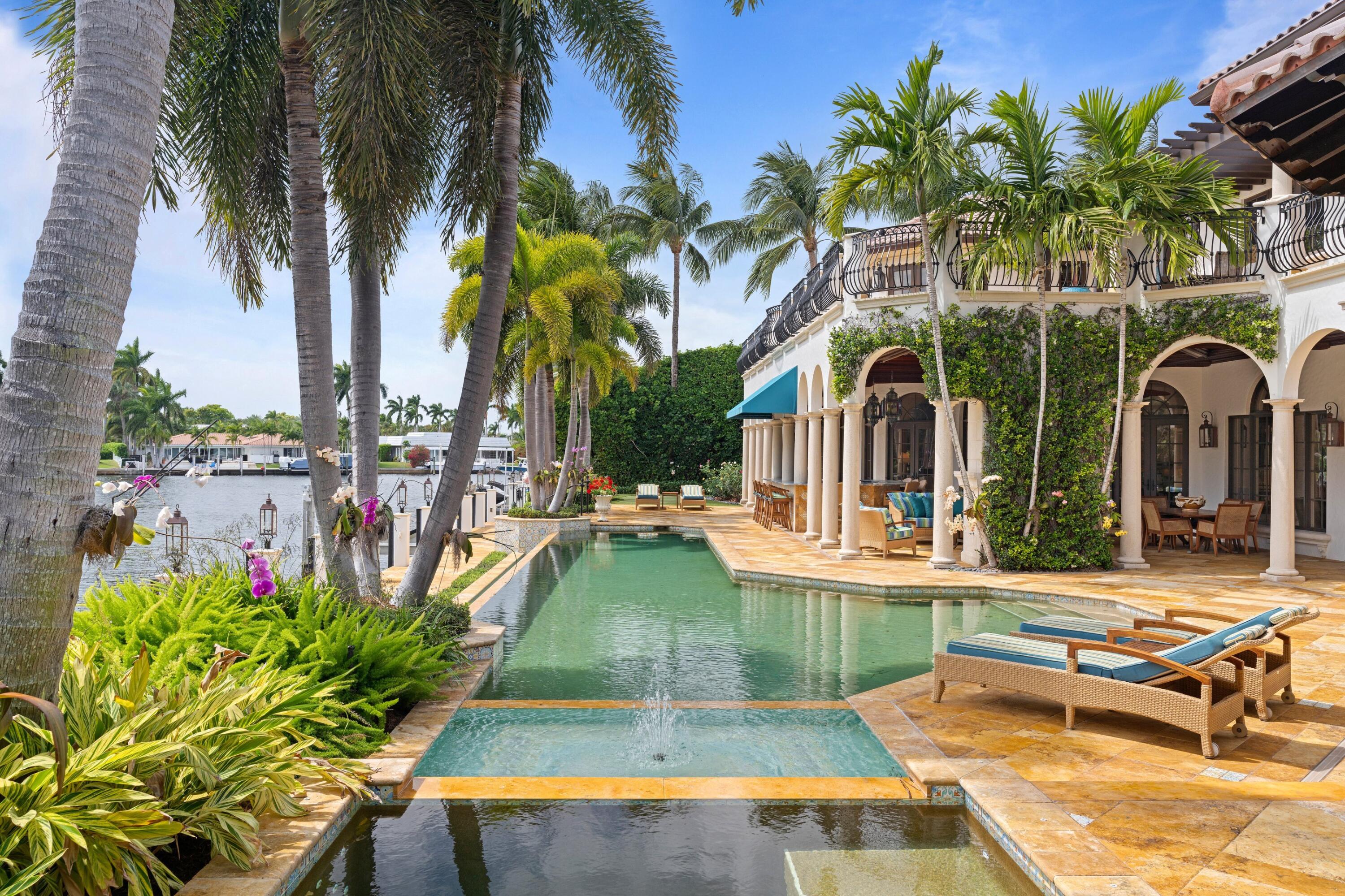 166 Alexander Palm Road Boca Raton, FL 33432 - Photo 18 of 122 a view of a house with swimming pool and sitting area