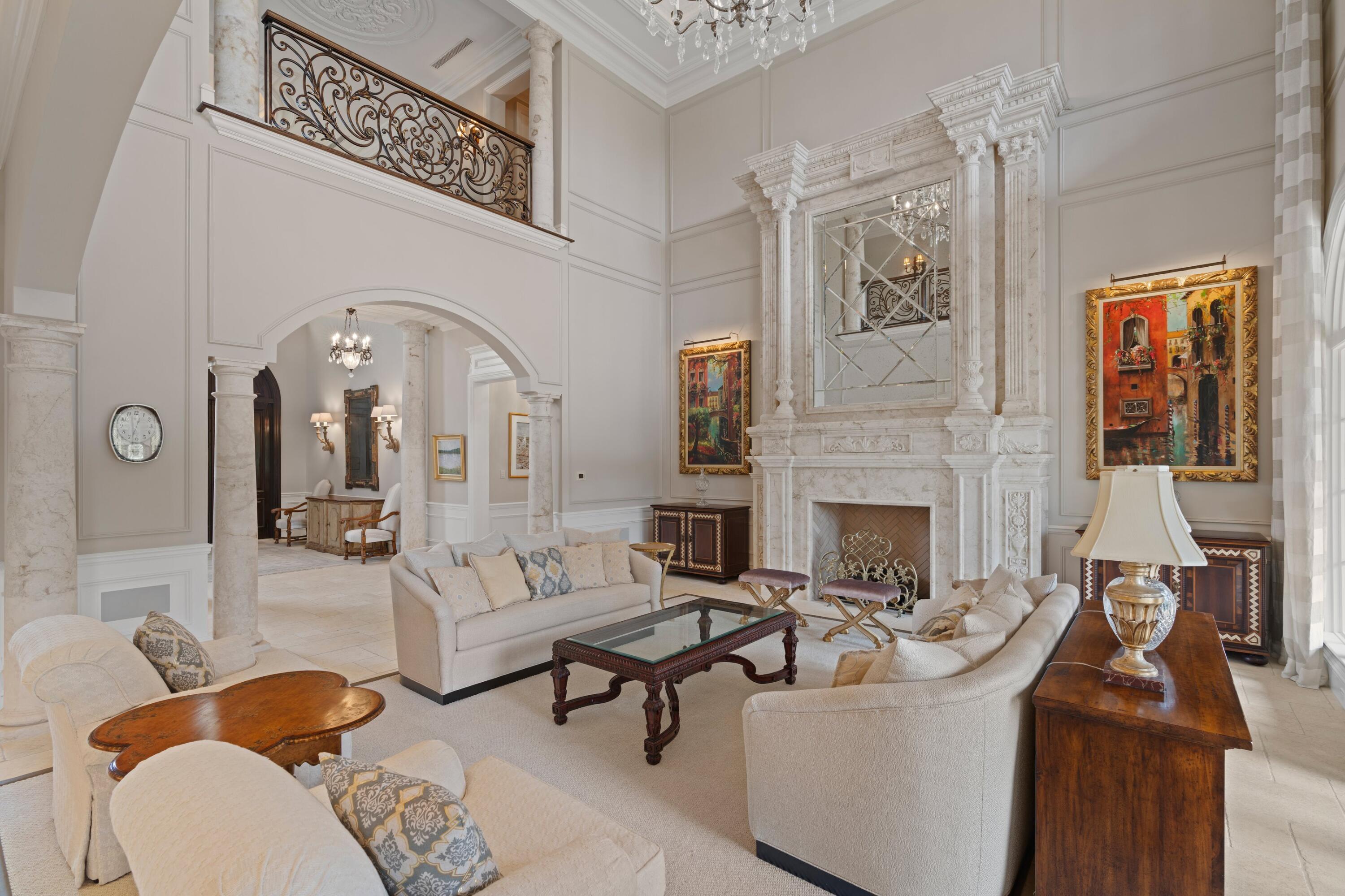 166 Alexander Palm Road Boca Raton, FL 33432 - Photo 31 of 122 a living room with furniture a fireplace and wall paintings