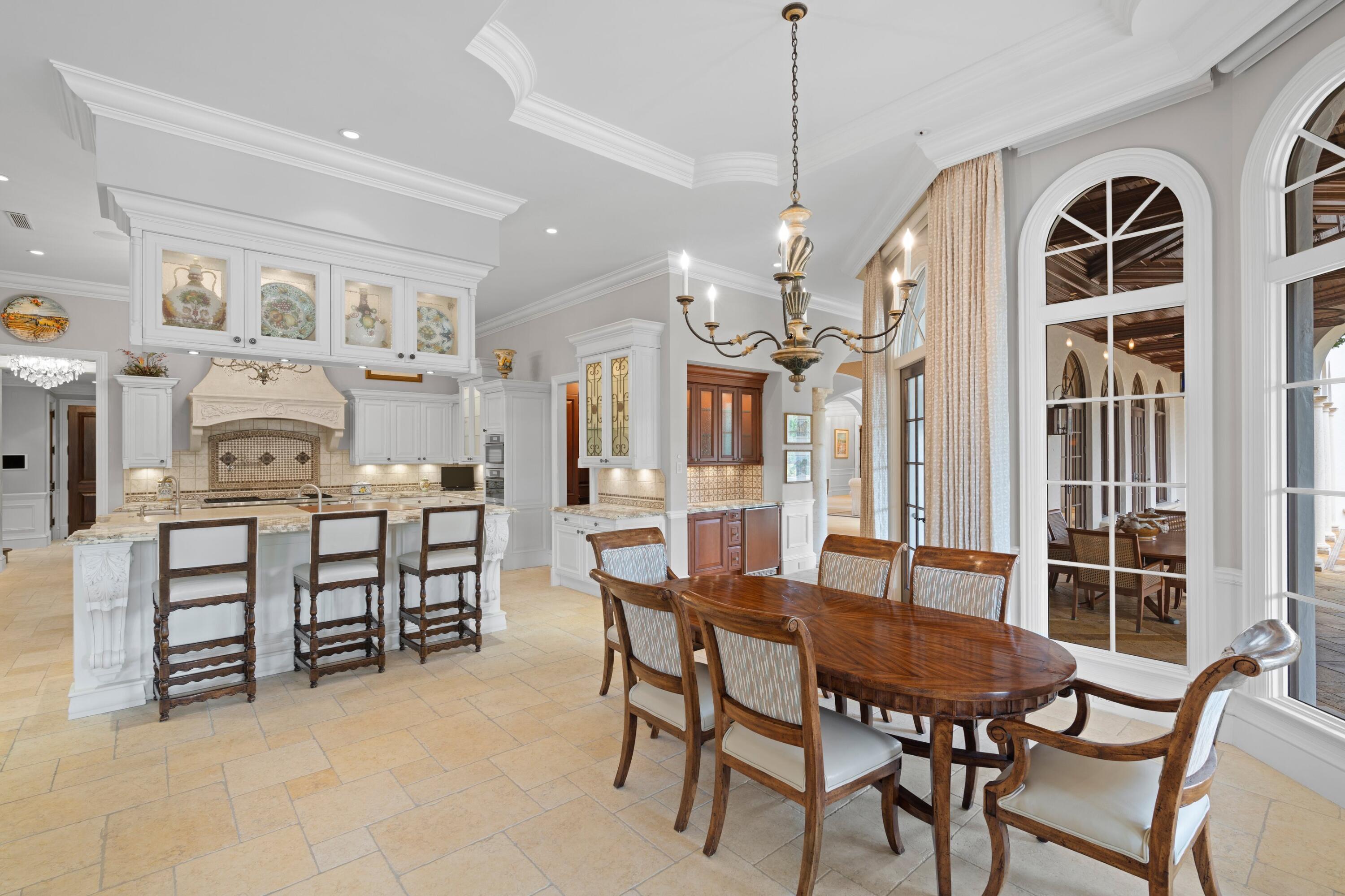 166 Alexander Palm Road Boca Raton, FL 33432 - Photo 46 of 122 a dining room with furniture and window