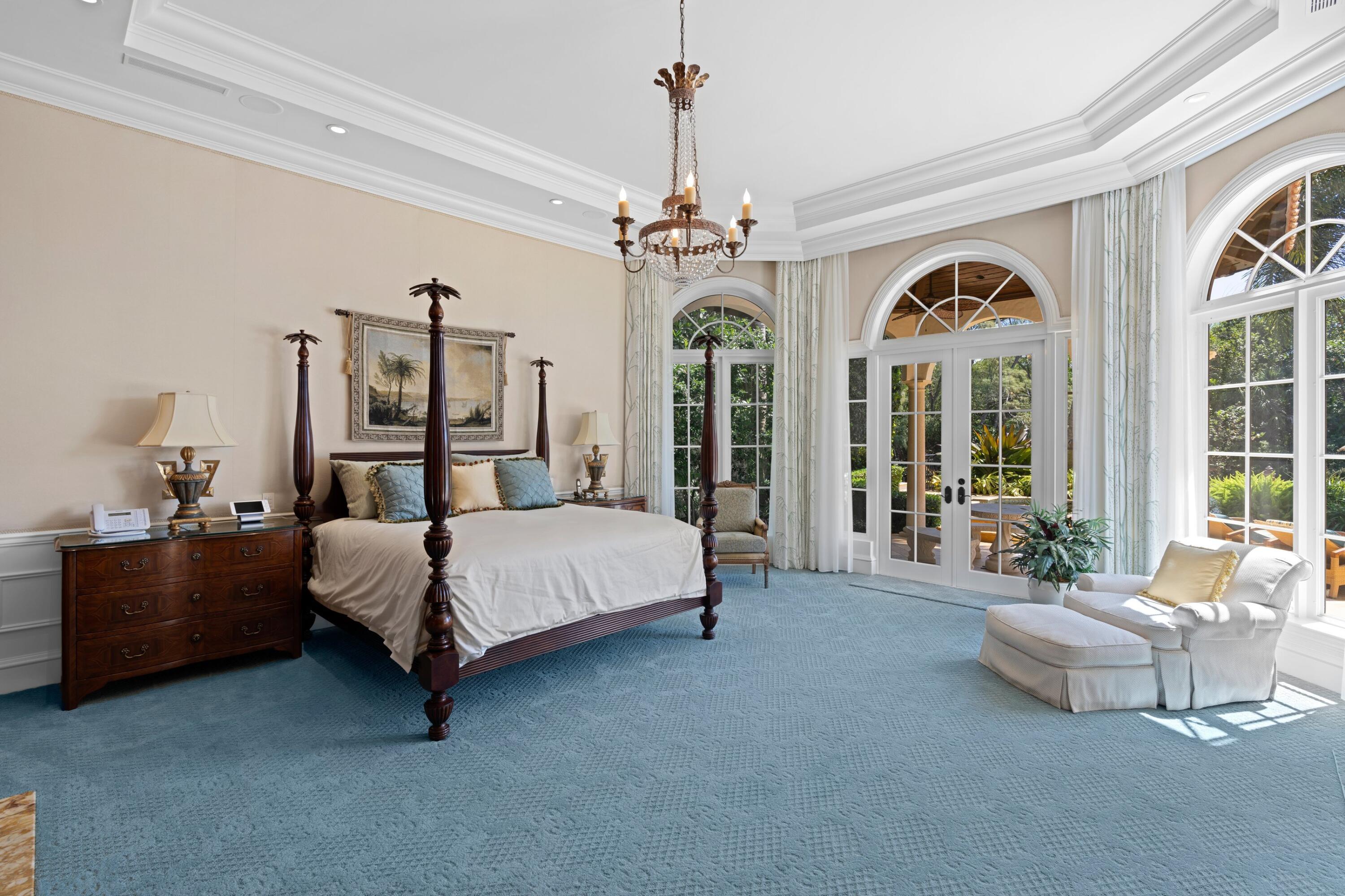 166 Alexander Palm Road Boca Raton, FL 33432 - Photo 56 of 122 a spacious bedroom with a bed couch and window