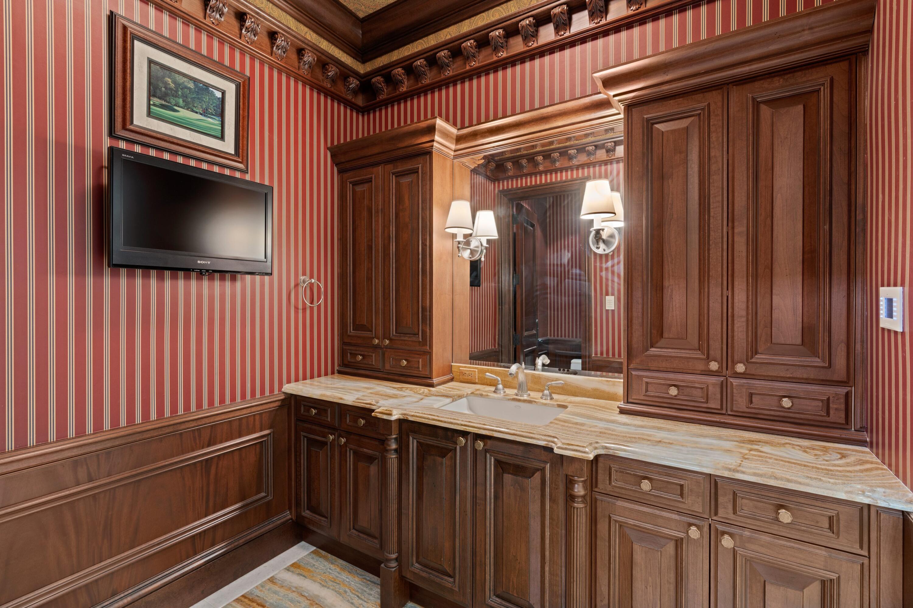 166 Alexander Palm Road Boca Raton, FL 33432 - Photo 66 of 122 a bathroom with a sink a mirror and a shower