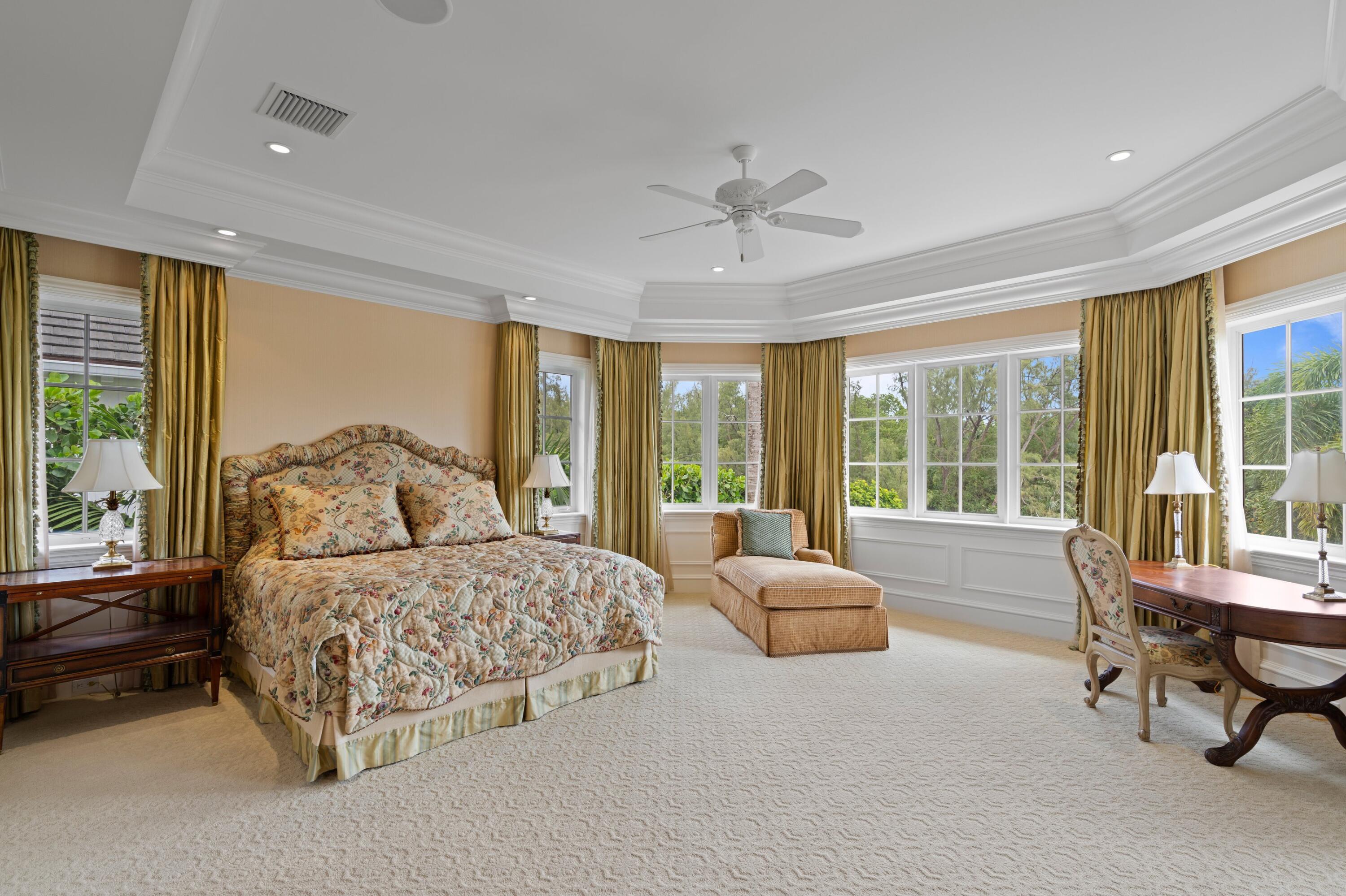 166 Alexander Palm Road Boca Raton, FL 33432 - Photo 82 of 122 a spacious bedroom with a bed and large window
