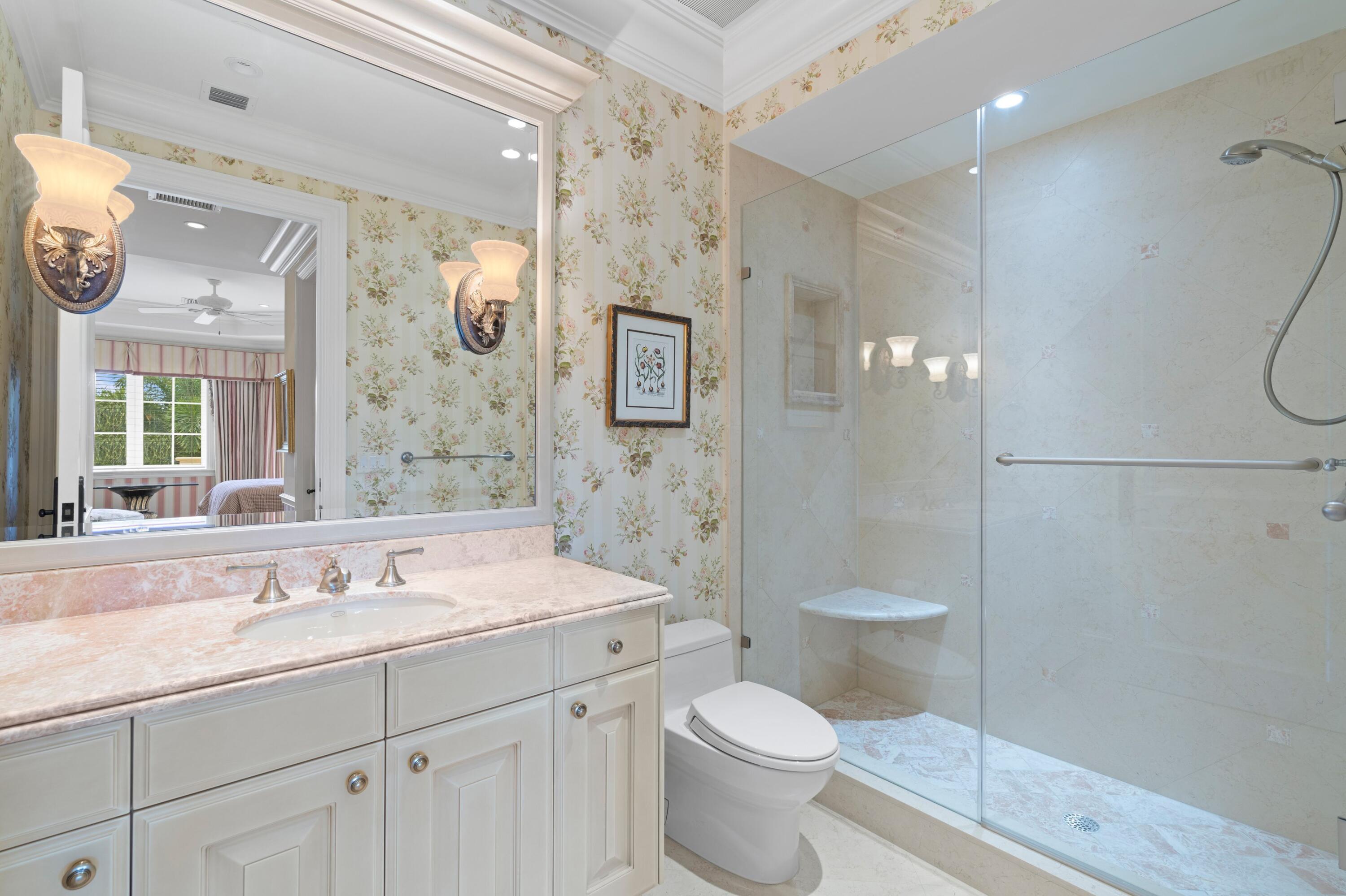 166 Alexander Palm Road Boca Raton, FL 33432 - Photo 90 of 122 a bathroom with a granite countertop sink a toilet and a shower