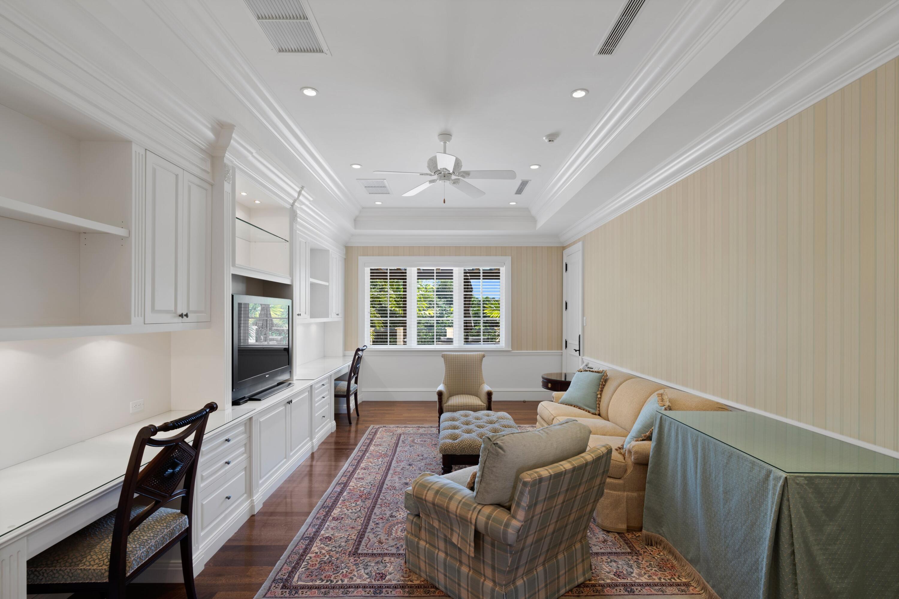 166 Alexander Palm Road Boca Raton, FL 33432 - Photo 97 of 122 a living room with furniture flat screen tv and a large window