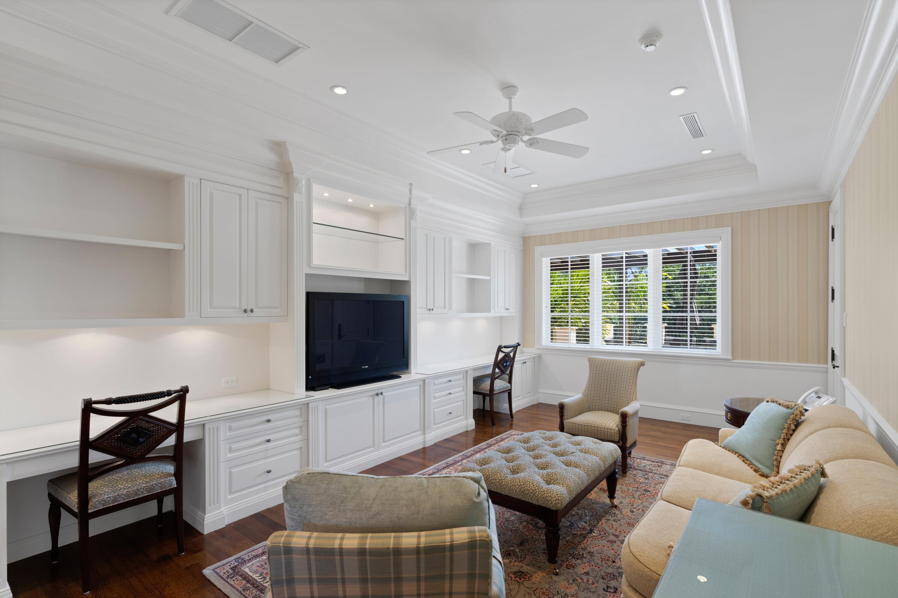 166 Alexander Palm Road Boca Raton, FL 33432 - Photo 98 of 122 a living room with furniture a flat screen tv and a window