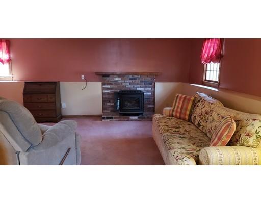 29 Walton Road Harwich, MA 02645 - Photo 16 of 23 a living room with furniture and a fireplace