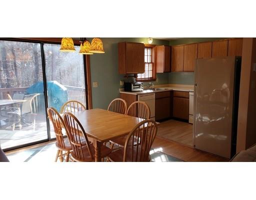 29 Walton Road Harwich, MA 02645 - Photo 5 of 23 a kitchen with a table chairs and refrigerator
