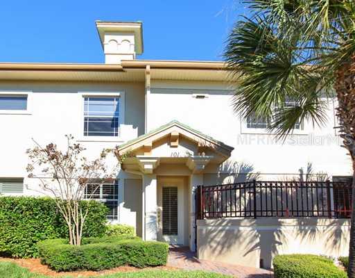6516 Moorings Point Circle, Unit 101 Lakewood Ranch, FL 34202 - Photo 1 of 1 Exterior Front - Highly desireable end unit with an eastern exposure for sunny mornings. Privacy wall with gate at paver patio.