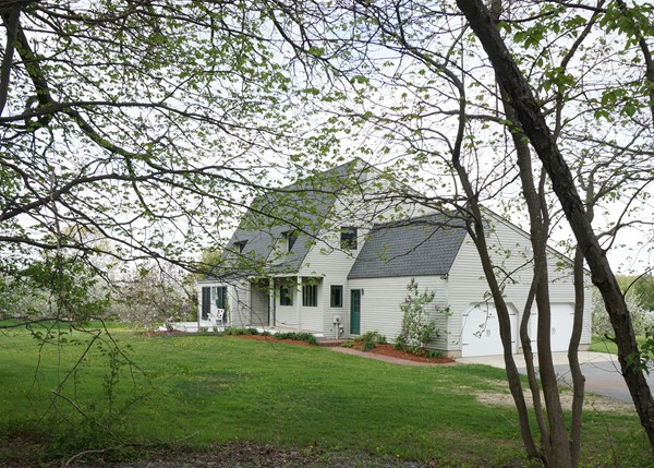 24 Prospect Hill Road Harvard, MA 01451 - Photo 1 of 28 a front view of a house with a garden