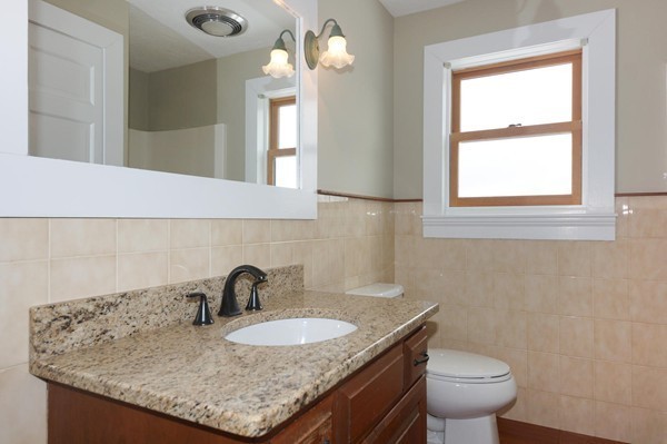24 Prospect Hill Road Harvard, MA 01451 - Photo 20 of 28 a bathroom with a granite countertop sink and a toilet