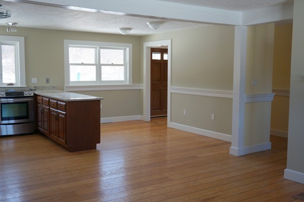 24 Prospect Hill Road Harvard, MA 01451 - Photo 4 of 28 an empty room with wooden floor and windows