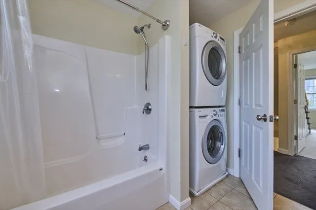 a bathroom with a sink a washer and dryer