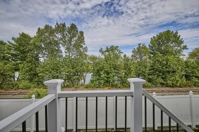 a balcony with trees in front of it