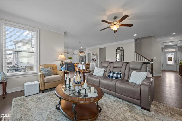 a living room with furniture fireplace and window
